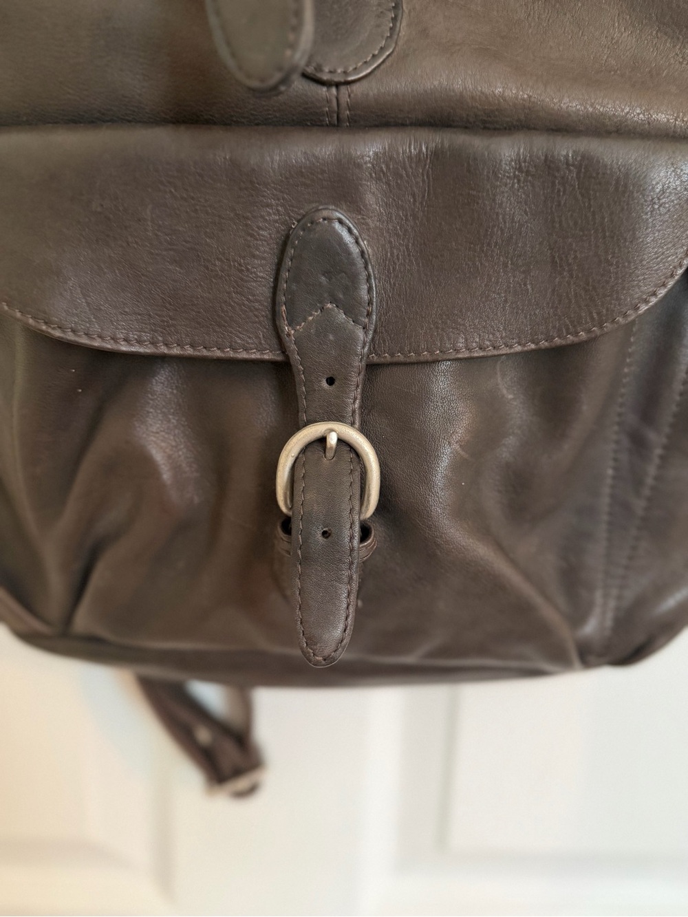 London Fog Brown Leather Backpack with Buckle drawstring